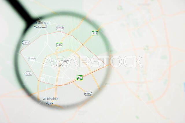 مدينة البكيرية في المملكة العربية السعودية - تصور توضيحي على الشاشة من خلال عدسة مكبرة مدينة البكيرية في المملكة العربية السعودية - تصور توضيحي على الشاشة من خلال عدسة مكبرة