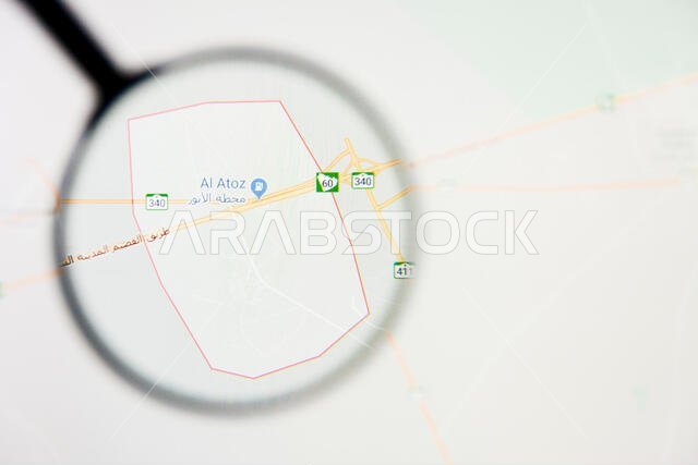 مدينة القرين في المملكة العربية السعودية - تصور توضيحي على الشاشة من خلال عدسة مكبرة مدينة القرين في المملكة العربية السعودية - تصور توضيحي على الشاشة من خلال عدسة مكبرة