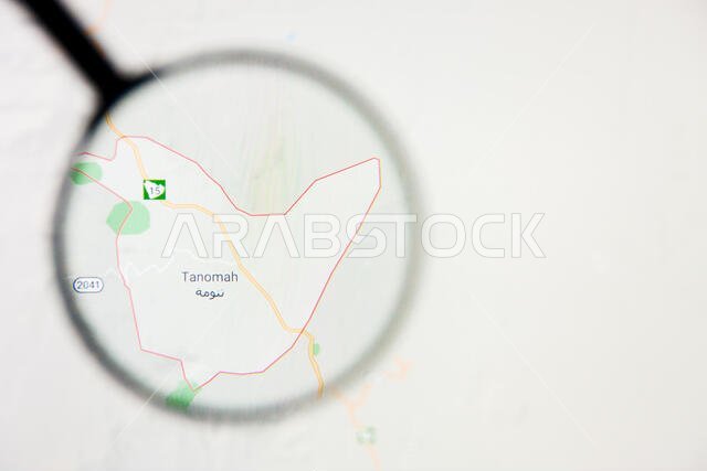 تصور مدينة تنومة في المملكة العربية السعودية، مفهوم توضيحي على الشاشة من خلال عدسة مكبرة تصور مدينة تنومة في المملكة العربية السعودية، مفهوم توضيحي على الشاشة من خلال عدسة مكبرة
