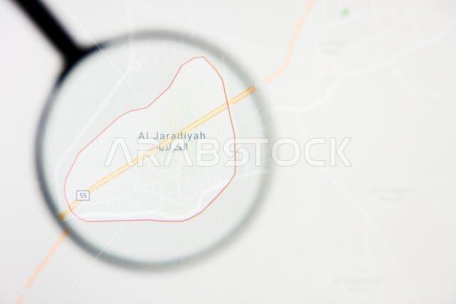 مدينة الجرادية في المملكة العربية السعودية - تصور توضيحي على الشاشة من خلال عدسة مكبرة مدينة الجرادية في المملكة العربية السعودية - تصور توضيحي على الشاشة من خلال عدسة مكبرة