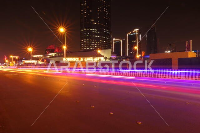 RIYADH, SAUDI ARABIA - DECEMBER 17, 2018: Busy traffic in the night at the famous Olaya Street in Riyadh, near of the Kingdom Centre