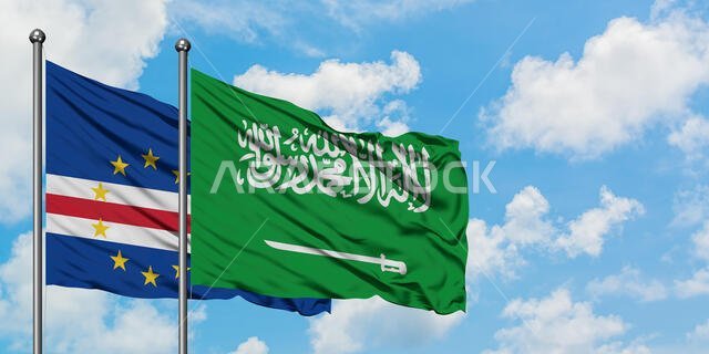 Cape Verde and Saudi Arabia flag waving in the wind against white cloudy blue sky together. Diplomacy concept, international relations.