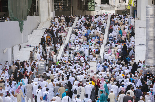 Close-up of Muslim pilgrims inside the Grand Mosque in Mecca, performing Hajj and Umrah, worship and getting closer to God, Islamic religious landmarks, Hajj season 2022