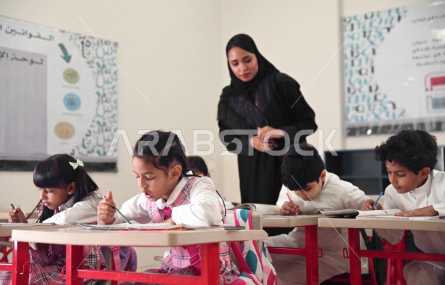 A Saudi Arabian Gulf teacher who monitors male and female students and helps them to read and solve problems, group school activities, education objectives in the prescribed curricula for male and female students in the Kingdom of Saudi Arabia.