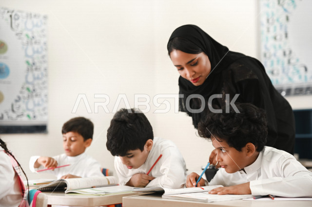 A Saudi Arabian Gulf teacher who monitors male and female students and helps them to read and solve problems, group school activities, education objectives in the prescribed curricula for male and female students in the Kingdom of Saudi Arabia.