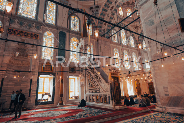 A group of worshipers inside the mosque, Islamic designs and decorations, a mosque with wonderful decorations and designs, the interior architecture of mosques, worship and getting closer to God, Islamic and worship