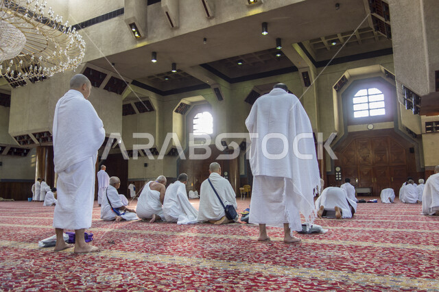 A group of pilgrims at Aisha Mosque at the Miqat of Al-Tana’im in Makkah Al-Mukarramah, the Miqat for the people of Makkah (Al-Tana’im), Ihram from the Miqat Al-Tana’im, Aisha Mosque, preparing to perform the Hajj in Makkah Al-Mukarramah
