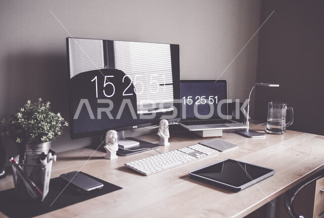 A group of modern technical devices on the office table, the development of technology and technology, computers and tablets on the office table, companies and offices, office table, office background, office work environment, office freelance work, work 
