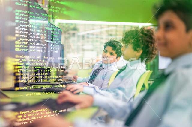 A picture of Saudi Arabian Gulf students in the classroom learning on the computer, placement tests, an educational platform for distance learning, the concept of online learning, hologram writing.