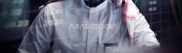 رجل عربي خليجي سعودي  يجلس أمام لوحة الكترونية هولوجراميه رقميه ،  متابعة سوق العملات الرقمية ، مراقبة صعود و نزول البورصة المالية ، الاستثمار و التداول في البورصة ، الاقتصاد والنمو المالي, سوق الأسهم 