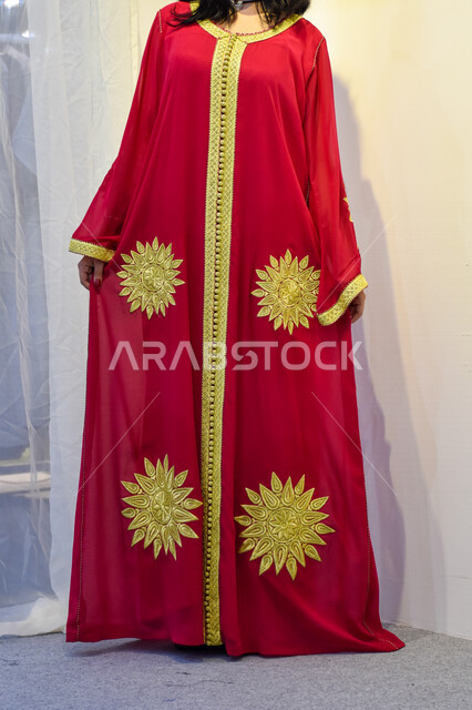 A Saudi Arabian Gulf woman wearing a colorful abaya, women's abayas with  distinctive modern designs, fashion and elegance, veiled fashion,  contemporary women's abayas, fashion and fashion - Photo