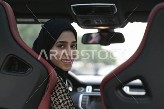 Ksa Car Rear View A picture from the back seat of the car of a smiling Saudi Arabian Gulf ...