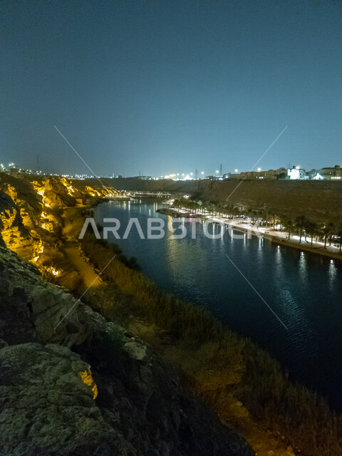 Namar Riyadh Wadi Namar Park in the city of Riyadh, Saudi Arabia at night, tourist ...