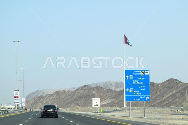 Modern, empty highway in Oman with speed limit signs, street lights and ...