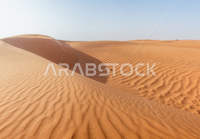 Sand dunes in desert areas, sand formations, golden sands in the desert, desert terrain, desert areas, beauty of desert nature