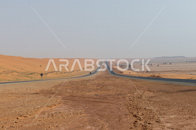 Highway in the middle of the desert, desert road, asphalt highway between sand dunes, desert nature, sand dunes, desert tourist areas, desert travel road
