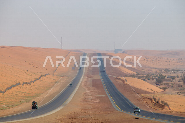 Highway in the middle of the desert, desert road, asphalt highway between sand dunes, desert nature, sand dunes, desert tourist areas, desert travel road