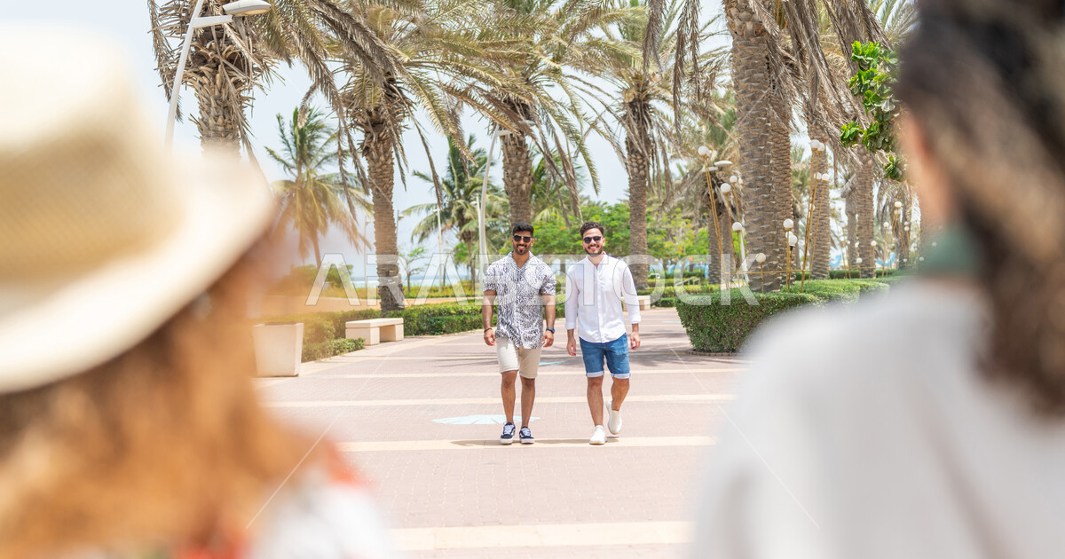 A group of Saudi Arab Gulf friends meet on the promenade of the Jeddah