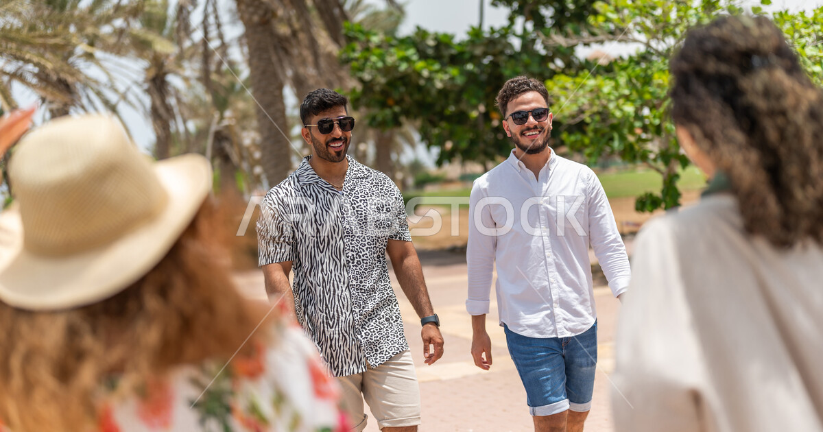 A group of Saudi Arab Gulf friends meet on the promenade of the Jeddah
