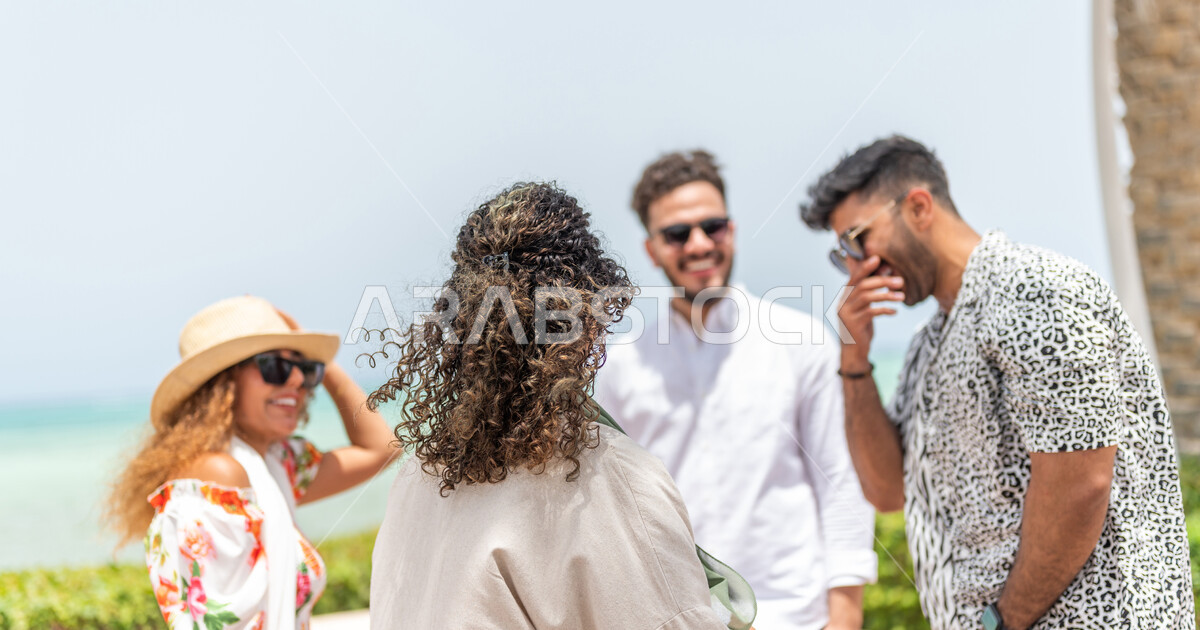 A group of Saudi Arab Gulf friends meet on the promenade of the Jeddah