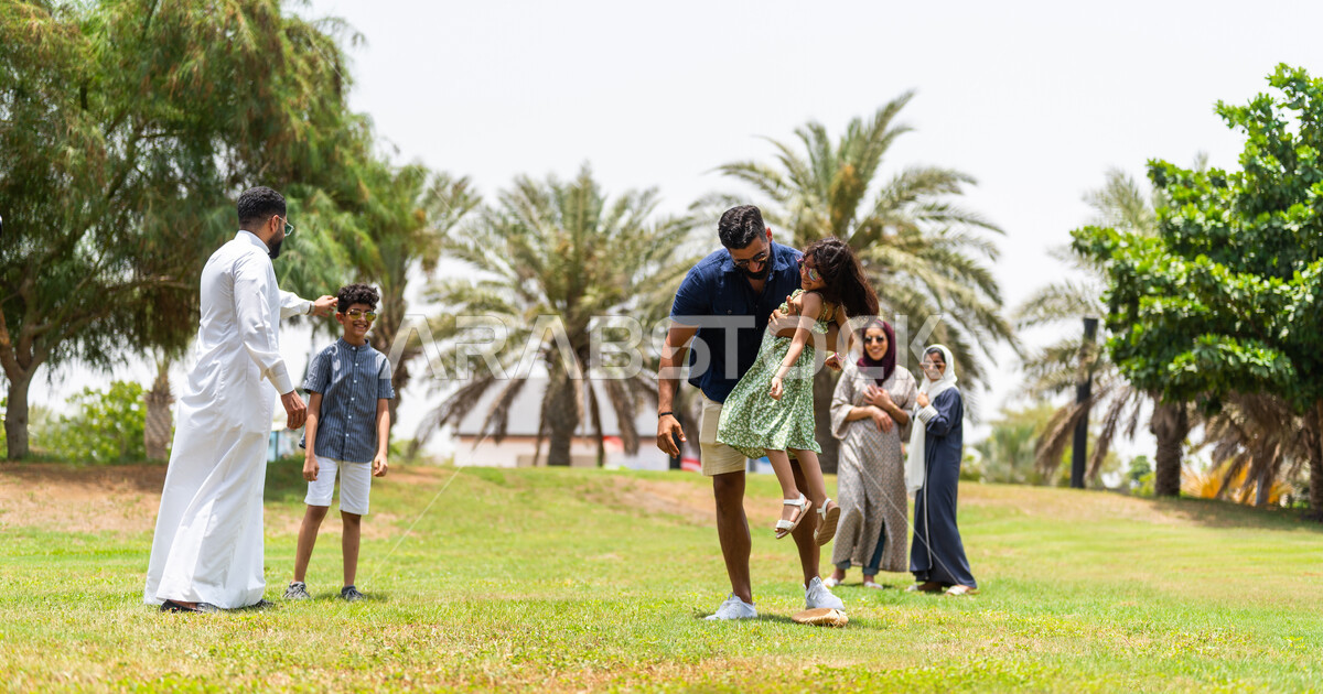 A Saudi Arabian Gulf family spends enjoyable times in one of the recreational parks in Saudi