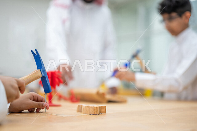 A group of Saudi Arabian Gulf students in an advanced educational school environment in the classroom, the Montessori education system, smart education, a new world of education, promoting science and innovation, skills development, innovative schools, qu