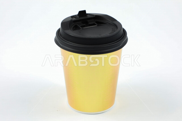 Close-up of a closed paper cup, black lid, thermal mug, white ...