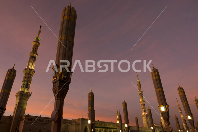 Creative image of electronic umbrellas in the courtyard of the Prophet’s Mosque in Medina at sunset, Saudi Arabia, the Prophet’s Mosque, the landmarks of the Prophet’s Mosque, worship and getting closer to God, the minaret of the Prophet’s Mosque