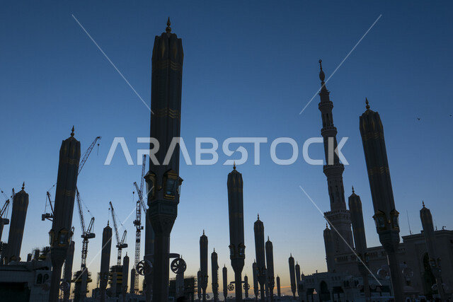 Creative image of electronic umbrellas in the courtyard of the Prophet’s Mosque in Medina at sunset, Saudi Arabia, the Prophet’s Mosque, the landmarks of the Prophet’s Mosque, worship and getting closer to God, the minaret of the Prophet’s Mosque