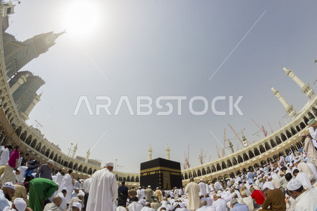 A panorama depiction of the Great Mosque of Mecca, the Kaaba in Makkah Al-Mukarramah in the Kingdom of Saudi Arabia, the performance of Hajj and Umrah, circumambulation around the Kaaba, worship and getting closer to God, Islamic religious landmarks in Sa