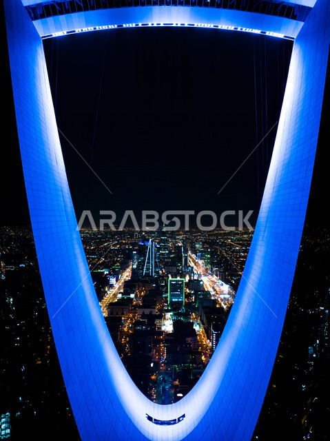 Creative night close-up of Kingdom Tower illuminated in blue, towers and skyscrapers, architecture in Saudi Arabia, famous tourist attractions in Riyadh in Saudi Arabia, Riyadh Towers at night, King Fahd Road in Riyadh