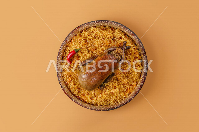 The popular delicious rice dish with stuffed pigeons, traditional Arab dishes, Arab food, popular dishes, delicious recipes and dishes, delicious meals, traditional Saudi dish, oriental restaurants, pigeon stuffed with rice, restaurants for oriental Arabi