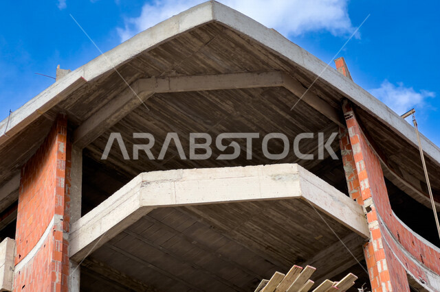 صورة مقربة لمبنى سكني تحت الانشاء، الطوب الاحمر، الهندسة المعمارية، التطور العمراني، مشاريع سكنية، شقق سكنية