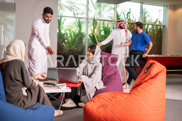 A group of Saudi Arabian Gulf university students at break time at the university, meeting in break time, chatting and conversations, advanced academic universities, Saudi Arab Gulf employees in the company’s cafe, dialogues and discussions, youth enterta