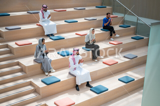 Saudi Arab Gulf university students in the university lecture hall, listening to the lecture, workshops, training courses, academic universities, advanced colleges and universities, Saudi Arab Gulf employees in a company, business meeting, dialogues and d
