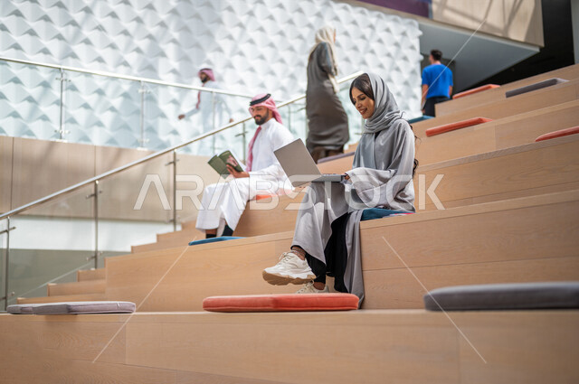 Saudi Arab Gulf university students in the university lecture hall, listening to the lecture, workshops, training courses, academic universities, advanced colleges and universities, Saudi Arab Gulf employees in a company, business meeting, dialogues and d