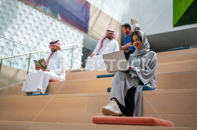 Close-up picture of Saudi Arab Gulf university students in the lecture hall at the university, listening to the lecture, workshops, training courses, advanced academic universities, Saudi Arab Gulf employees in a company, business meeting, dialogues and d