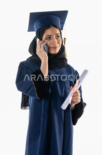 Portrait of a Saudi Gulf Arab student wearing an abaya and graduation ...