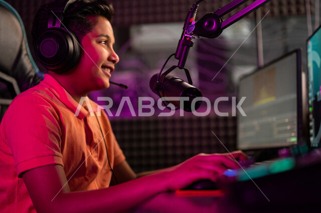 Close-up of a Saudi Arabian Gulf boy in an electronic game store, wearing a headset, a professional Saudi gamer in electronic video games, a live broadcasting platform in the world of video games, electronic video games, gaming technology, professional ga