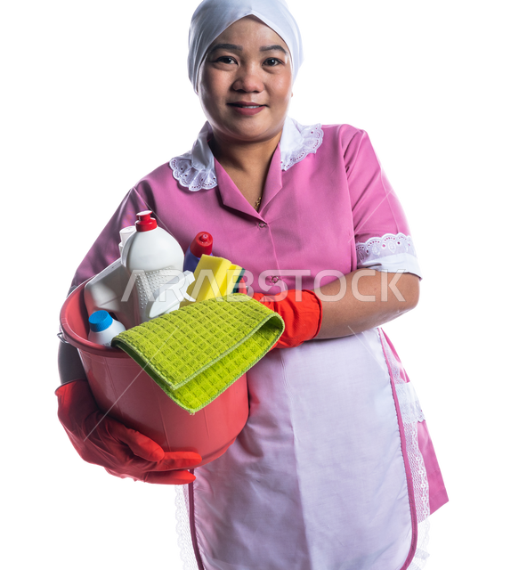 Portrait of a cleaning lady wearing gloves and apron, holding a bucket