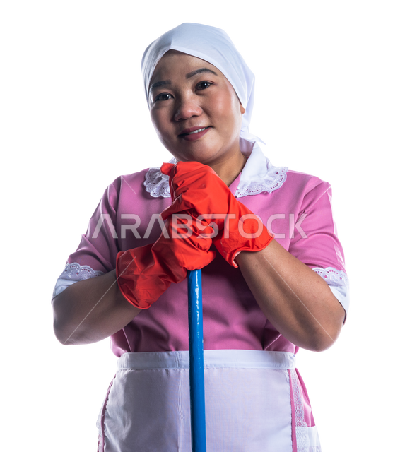 Portrait of a cleaning lady wearing gloves and apron, holding a hand ...