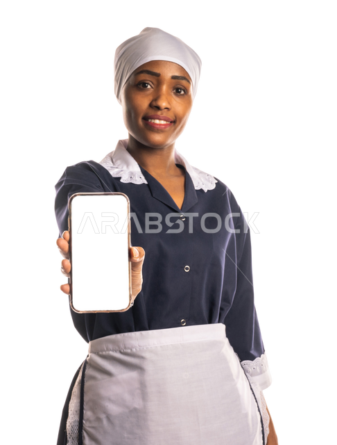 Portrait of a cleaner wearing an apron, looking at the camera, holding a mobile phone, showing a blank white screen, showing an app for mobile cleaners