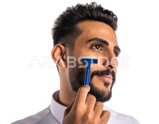 Closeup portrait of a Saudi Arabian Gulf man, removing facial hair