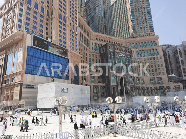 Close-up image of the courtyard of the Grand Mosque in Mecca, luxury hotels around the Grand Mosque, pilgrims and pilgrims in the outer courtyards of the mosque, Islam and worship, holy places in Saudi Arabia