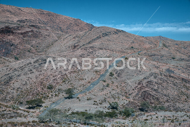Road through the mountains and desert heights of Saudi Arabia, desert terrain, mountainous nature, landscapes, nature background