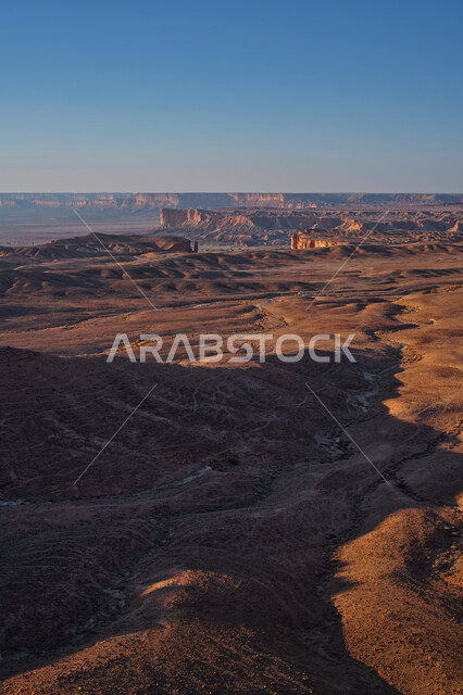 Creative image of the Tuwaiq mountains in Najd, the edge of the world in Riyadh, Saudi Arabia, tourism in Saudi Arabia, the beauty of mountainous desert landscapes, historical monuments in Saudi Arabia, desert areas