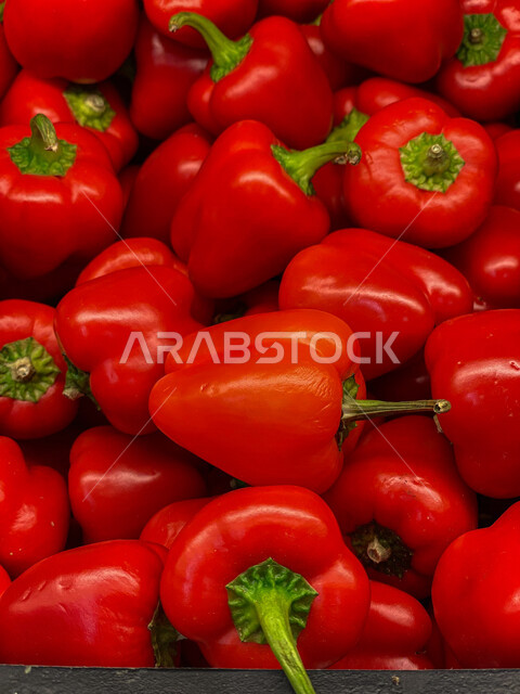 Close-up of red bell pepper vegetables, seasonal pepper sale, cold snapper, preserved red pepper crop, vegetable commodity for sale