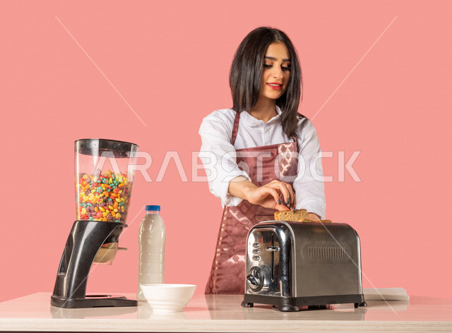 Portrait of an Arab woman preparing morning breakfast at the kitchen table healthy diet preparing slices of toast bread housewife healthy eating concept healthy breakfast healthy breakfast housekeeping colorful background