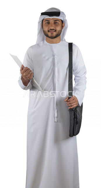Portrait of an Arab Gulf Emirati university student with a bag on his back, holding a university book in his hand, reading university books, reviewing daily lessons, university education in the United Arab Emirates, white background.