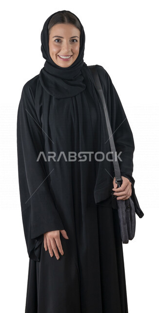 Portrait of a smiling, veiled Arab Emirati Gulf university student carrying a laptop bag on her shoulder, looking at the camera, an employee of an Emirati company, a young woman eager to go to work, white background